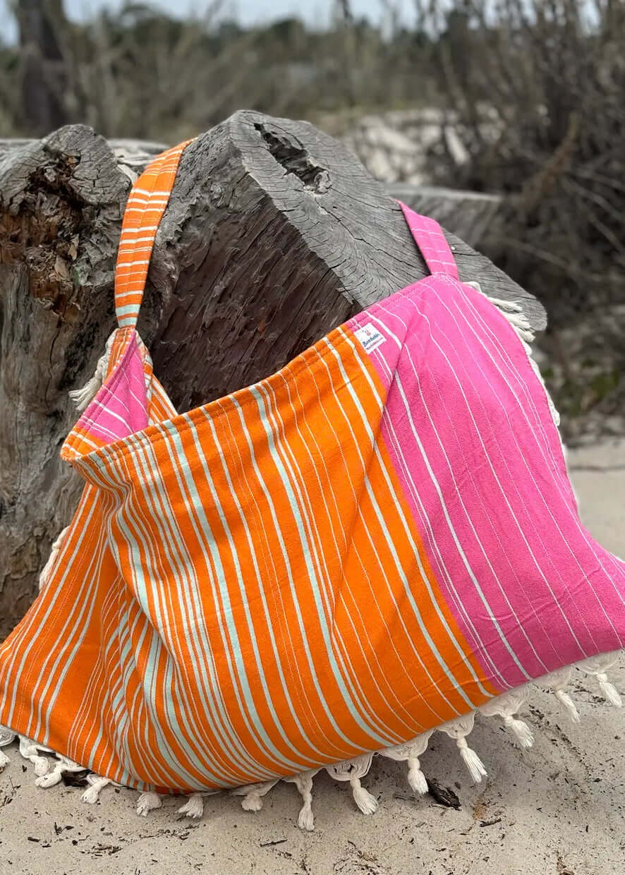 Shop the Beachables Striped 3-in-1 Turkish Cotton Beach Bag – converts from bag to towel to chair cover. Sand-resistant, quick-dry, machine washable. Made in USA.