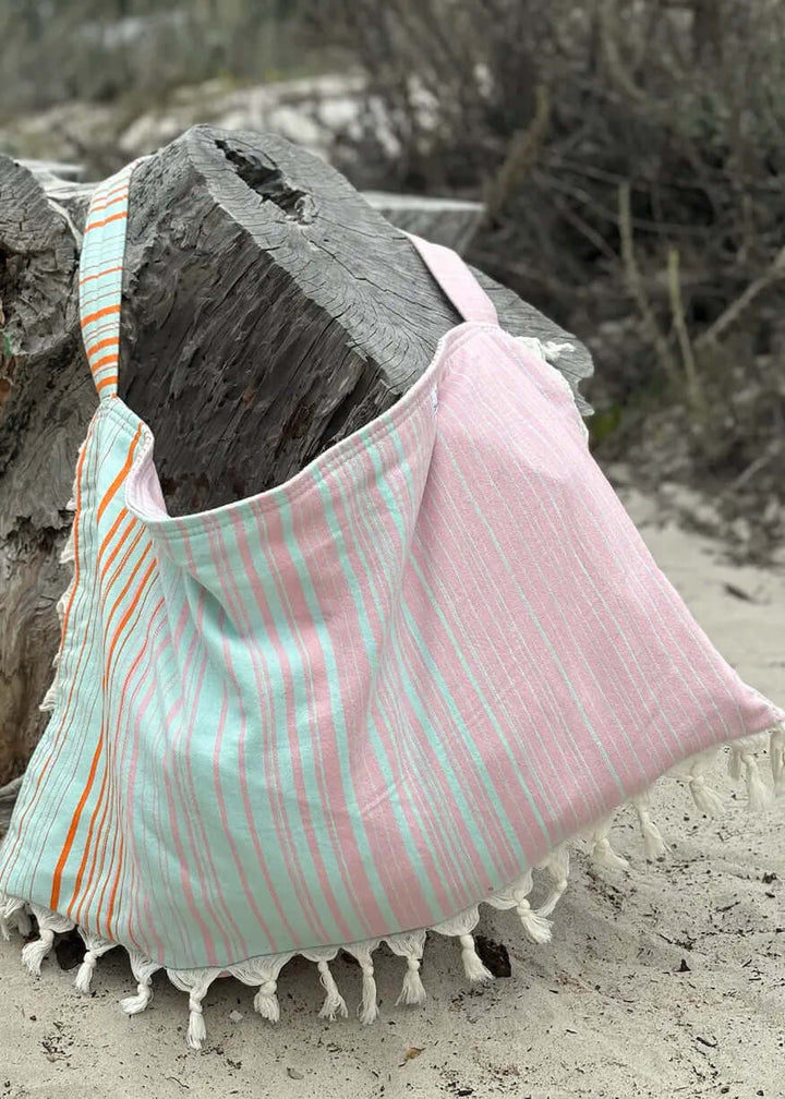 Shop the Beachables Striped 3-in-1 Turkish Cotton Beach Bag – converts from bag to towel to chair cover. Sand-resistant, quick-dry, machine washable. Made in USA.