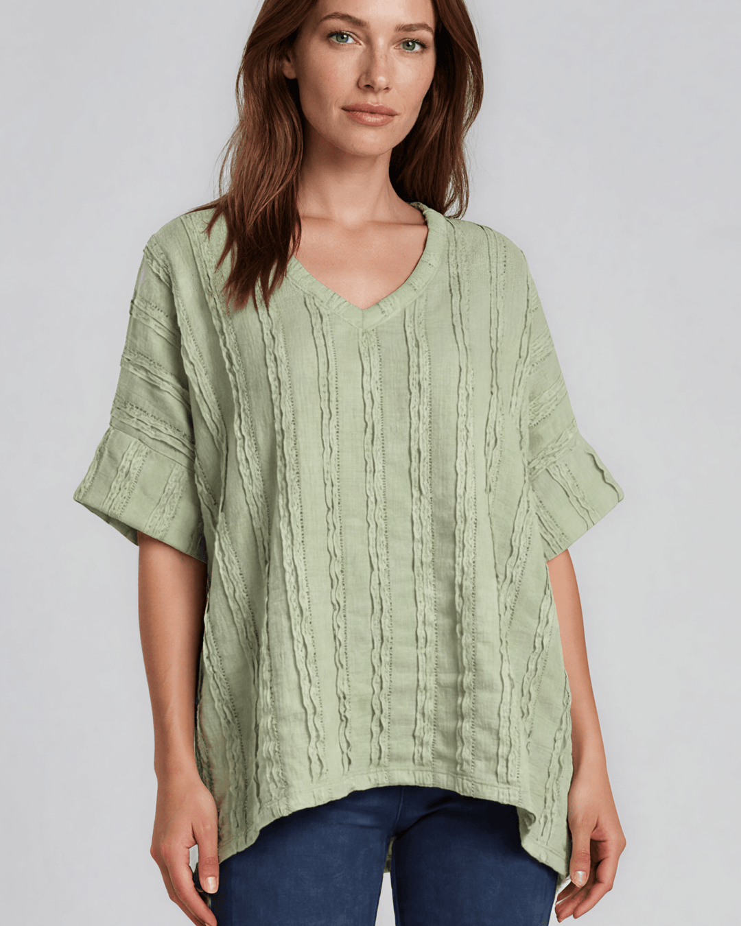 Shop the Laurel Textured Top in Light Sage — a relaxed oversized v-neck with striped lace effect, contrast sleeve bands & side slit. Made in USA.