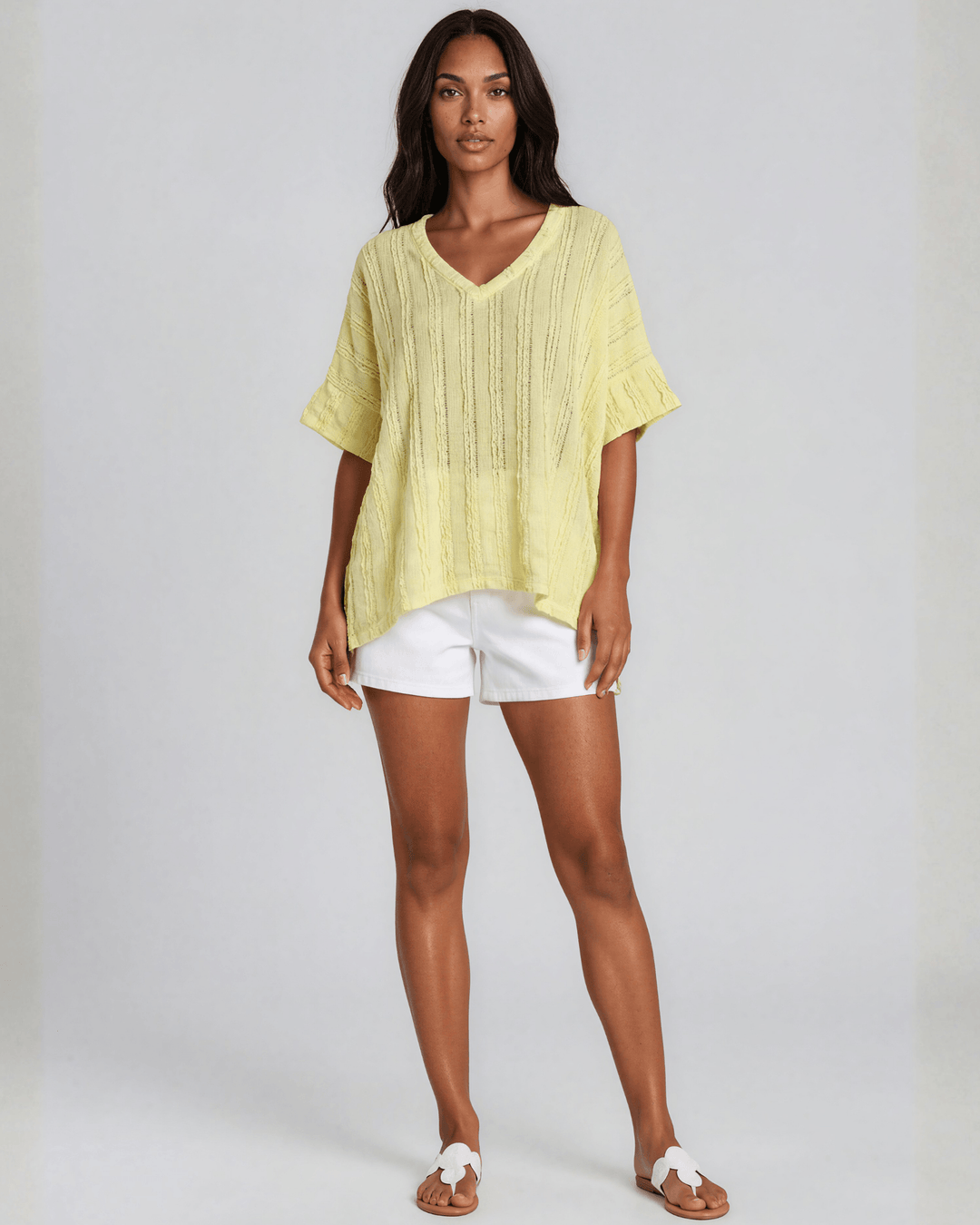 Shop the Laurel Textured Top in Yellow — a relaxed oversized v-neck with striped lace effect, contrast sleeve bands &amp; side slit. Made in USA.