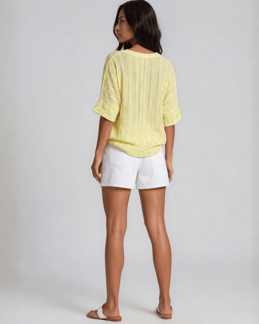 Shop the Laurel Textured Top in Yellow — a relaxed oversized v-neck with striped lace effect, contrast sleeve bands &amp; side slit. Made in USA.
