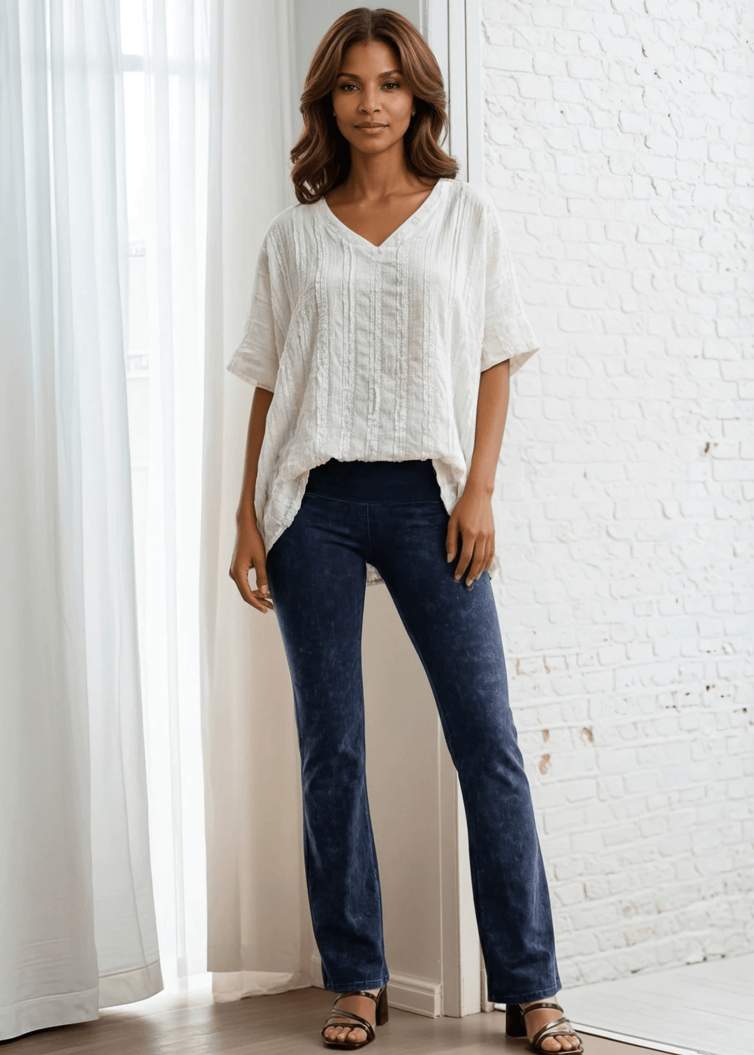 Elevate your everyday wardrobe with the Laurel Textured Top in Off White or Sage Green, a versatile Made in USA essential. This textured oversized v-neck features a delicate striped lace effect and half sleeves contrasting bands for a polished look. 