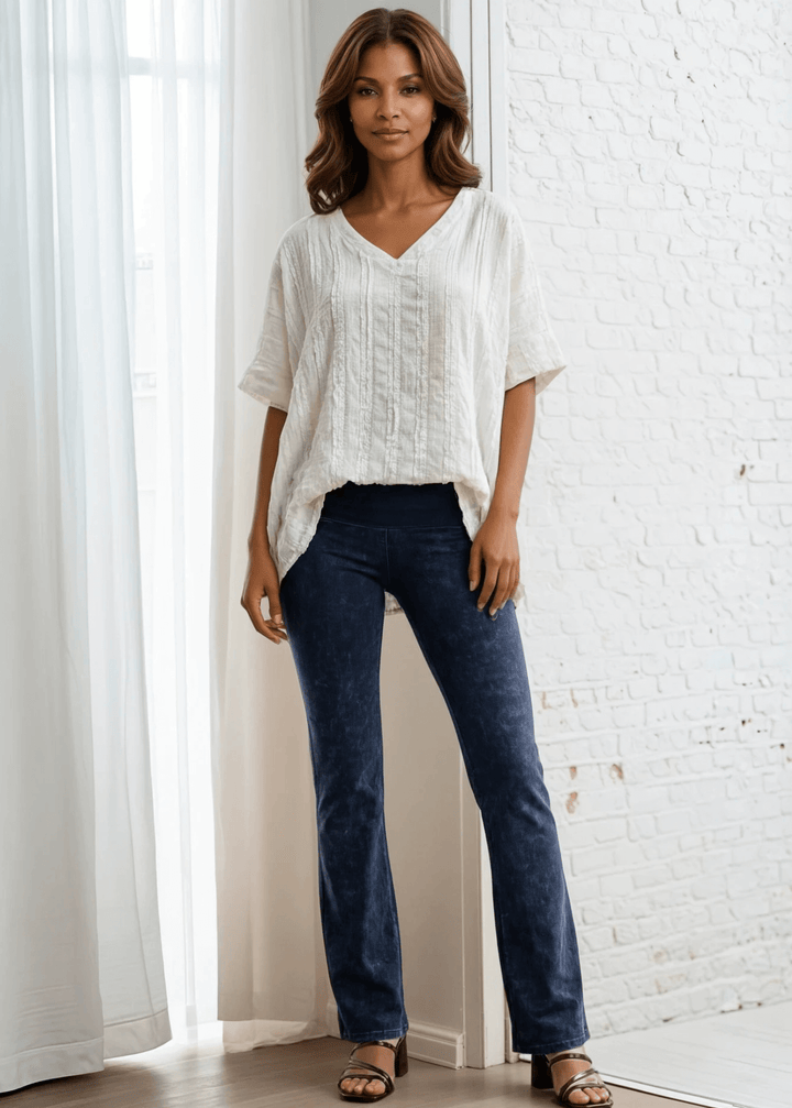 Elevate your everyday wardrobe with the Laurel Textured Top in Off White or Sage Green, a versatile Made in USA essential. This textured oversized v-neck features a delicate striped lace effect and half sleeves contrasting bands for a polished look. 