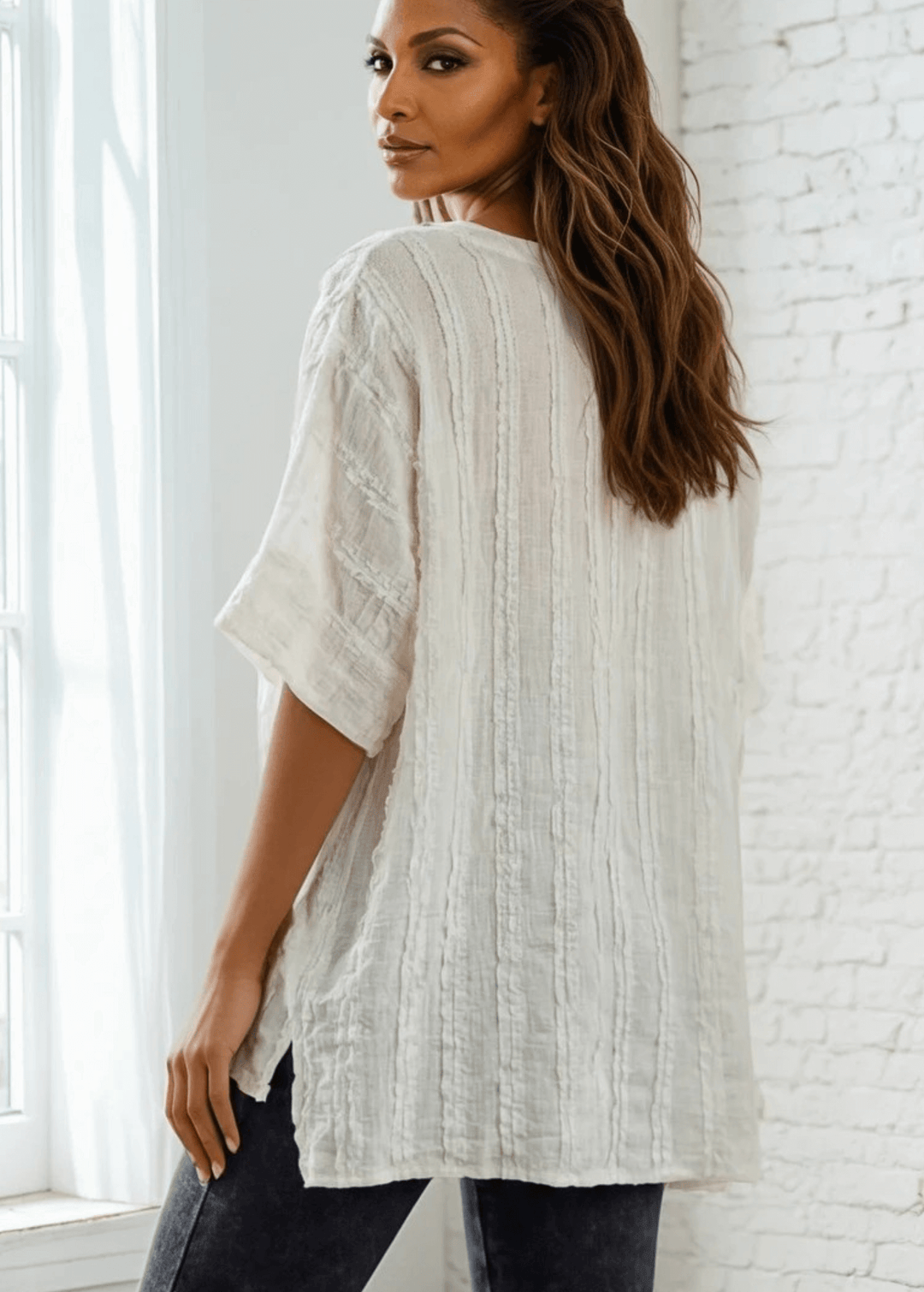Elevate your everyday wardrobe with the Laurel Textured Top in Off White or Sage Green, a versatile Made in USA essential. This textured oversized v-neck features a delicate striped lace effect and half sleeves contrasting bands for a polished look. 