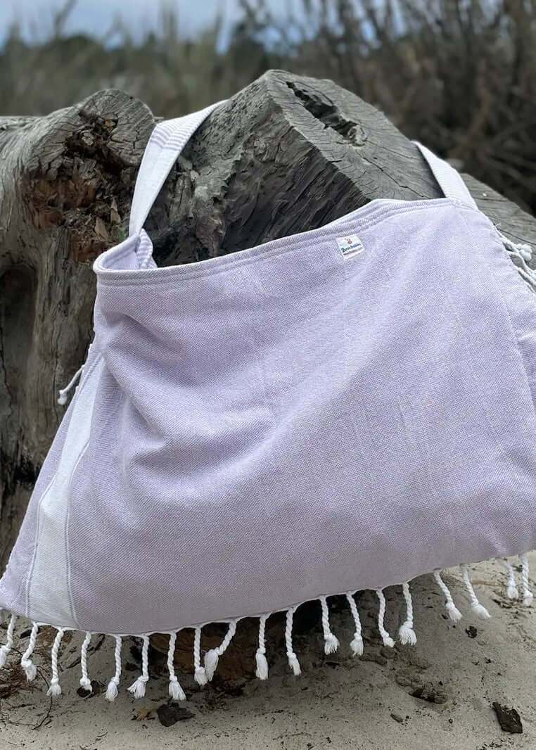 Shop the Beachables Solid 3-in-1 Turkish Cotton Beach Bag – converts from bag to towel to chair cover. Sand-resistant, quick-dry, machine washable. Made in USA.