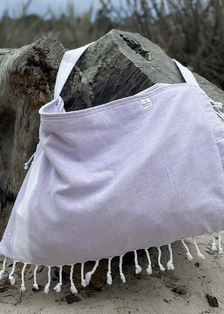 Shop the Beachables Solid 3-in-1 Turkish Cotton Beach Bag – converts from bag to towel to chair cover. Sand-resistant, quick-dry, machine washable. Made in USA.