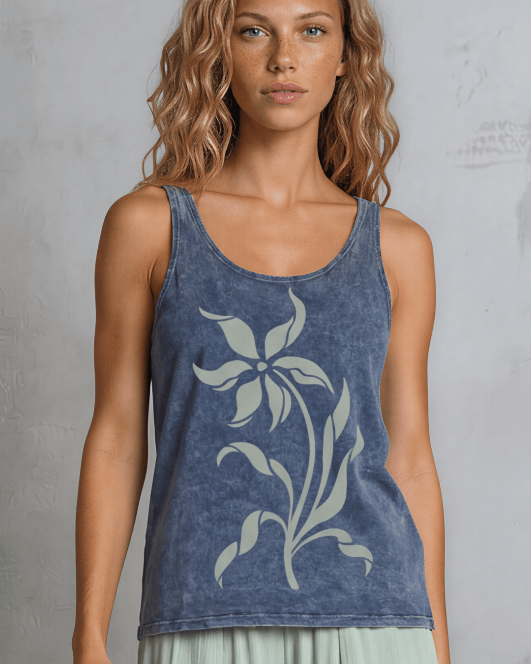 Lily Whisper botanical floral graphic tank in mineral-washed denim blue. Made in USA with USA-grown cotton, soft 95% cotton/5% spandex, relaxed fit.
