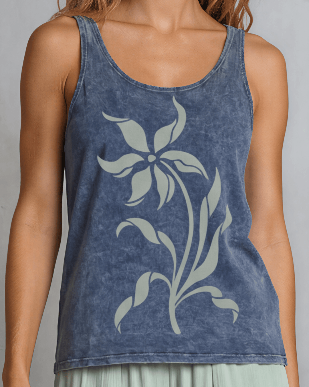 Lily Whisper botanical floral graphic tank in mineral-washed denim blue. Made in USA with USA-grown cotton, soft 95% cotton/5% spandex, relaxed fit.