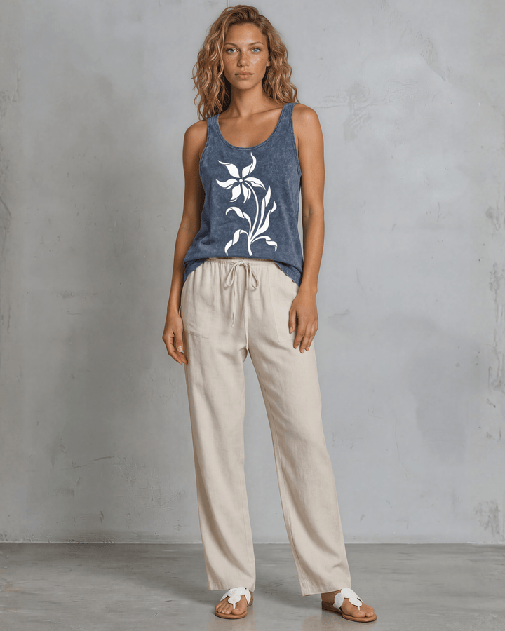 Lily Whisper botanical floral graphic tank in mineral-washed denim blue. Made in USA with USA-grown cotton, soft 95% cotton/5% spandex, relaxed fit.