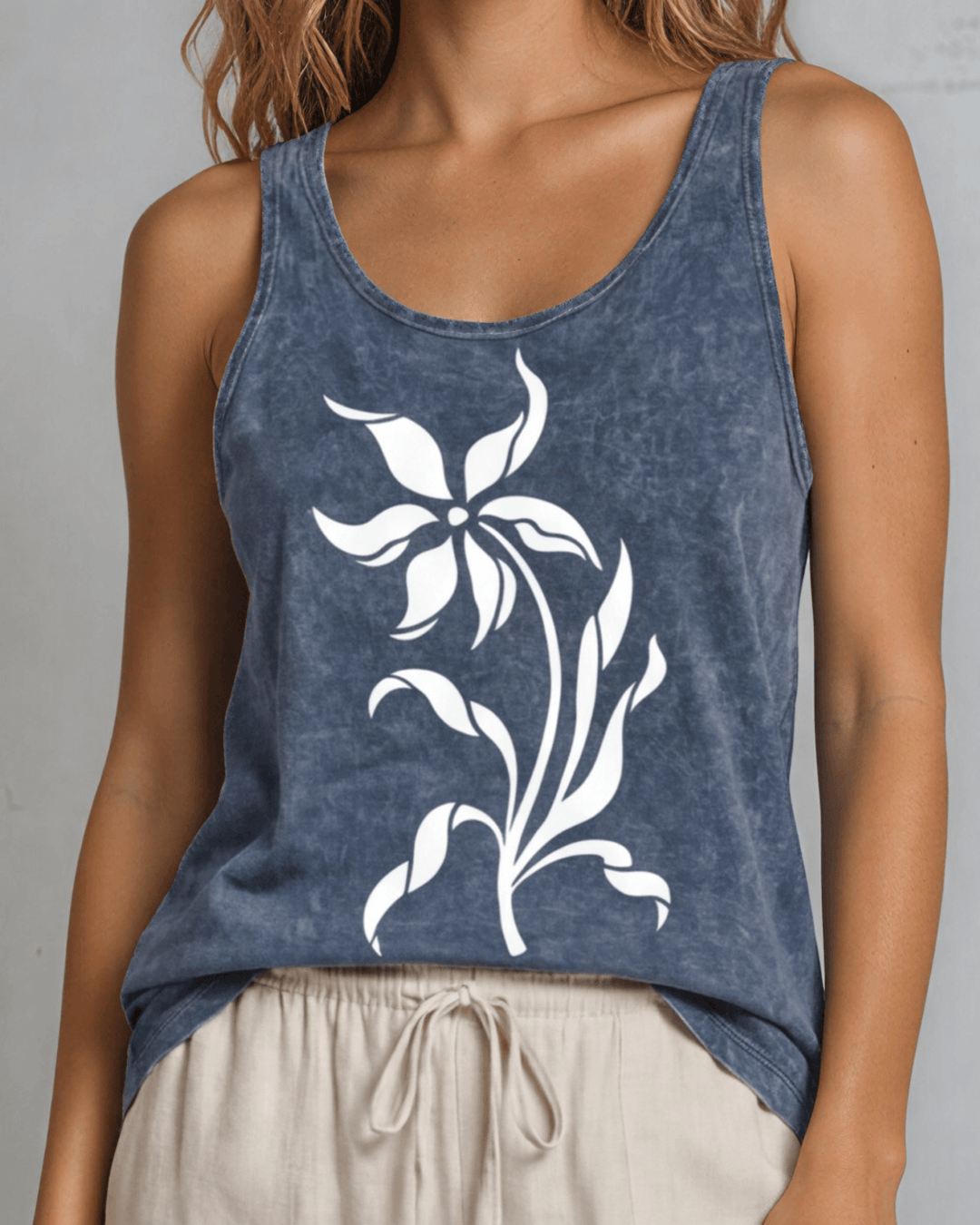 Lily Whisper botanical floral graphic tank in mineral-washed denim blue. Made in USA with USA-grown cotton, soft 95% cotton/5% spandex, relaxed fit.