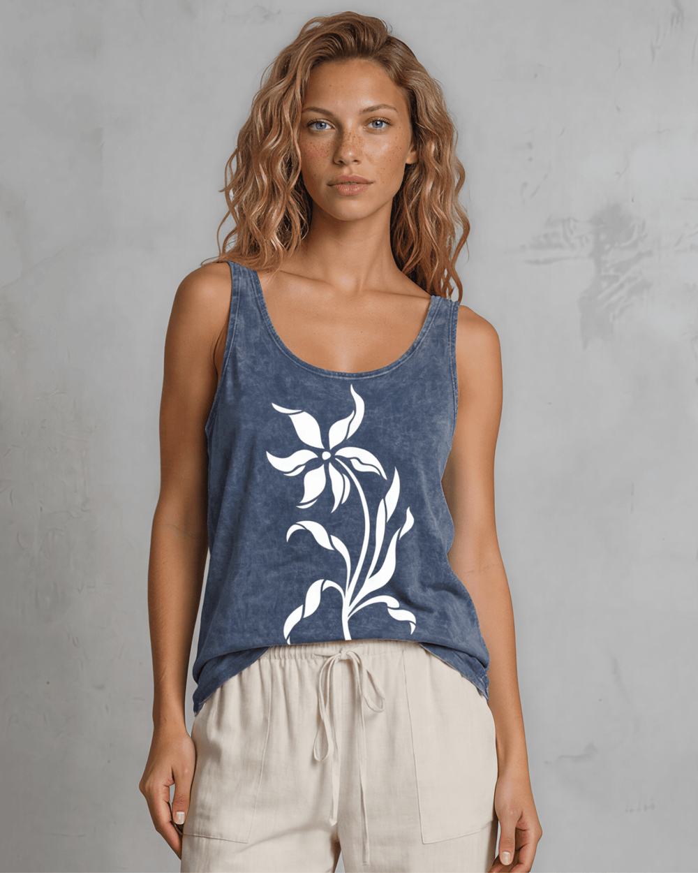 Lily Whisper botanical floral graphic tank in mineral-washed denim blue. Made in USA with USA-grown cotton, soft 95% cotton/5% spandex, relaxed fit.