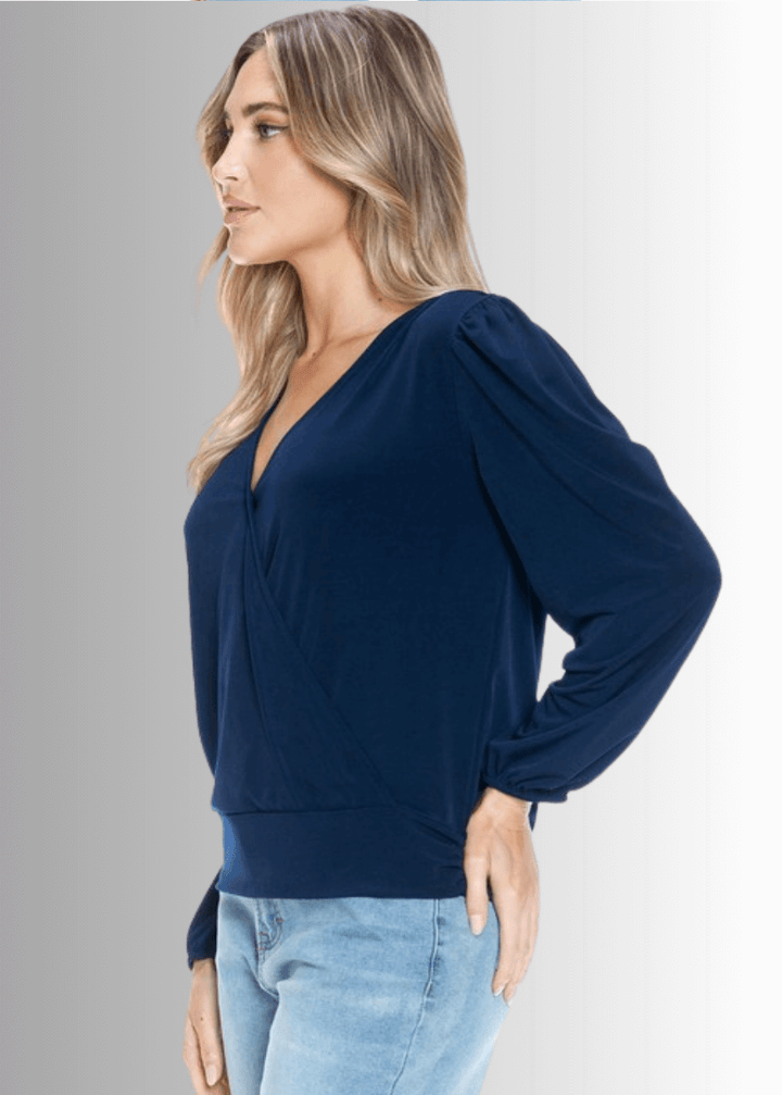 Elevate your wardrobe with the Maxine Surplice Tie Back Top in navy. Crafted in the USA from stretchy jersey fabric, this waist-length, long-sleeve, both comfort and style