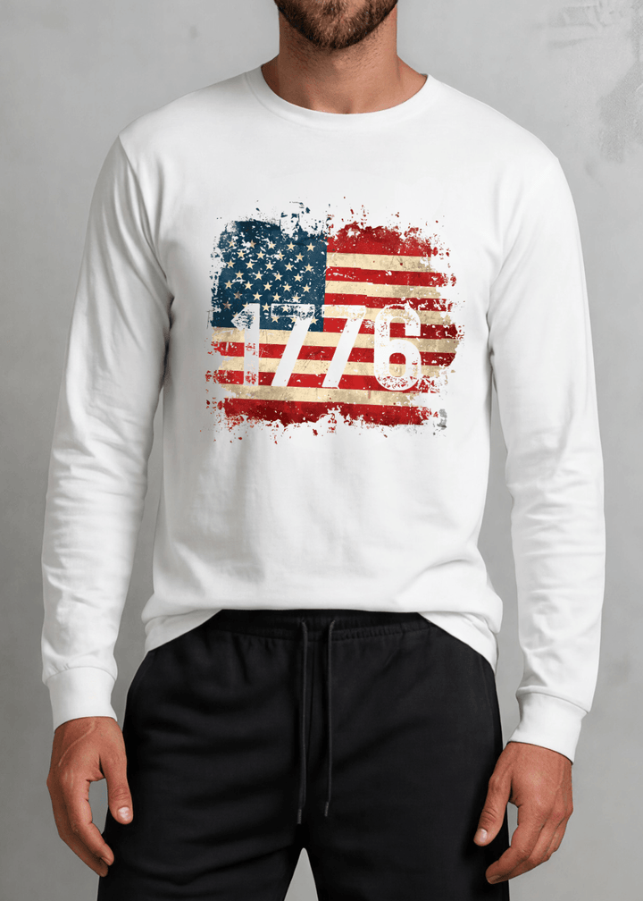 1776 Distressed American Flag Long Sleeve Tee — Made in USA with USA Cotton. Bold vintage flag graphic on white, 100% pre-shrunk cotton. Perfect for 4th of July.