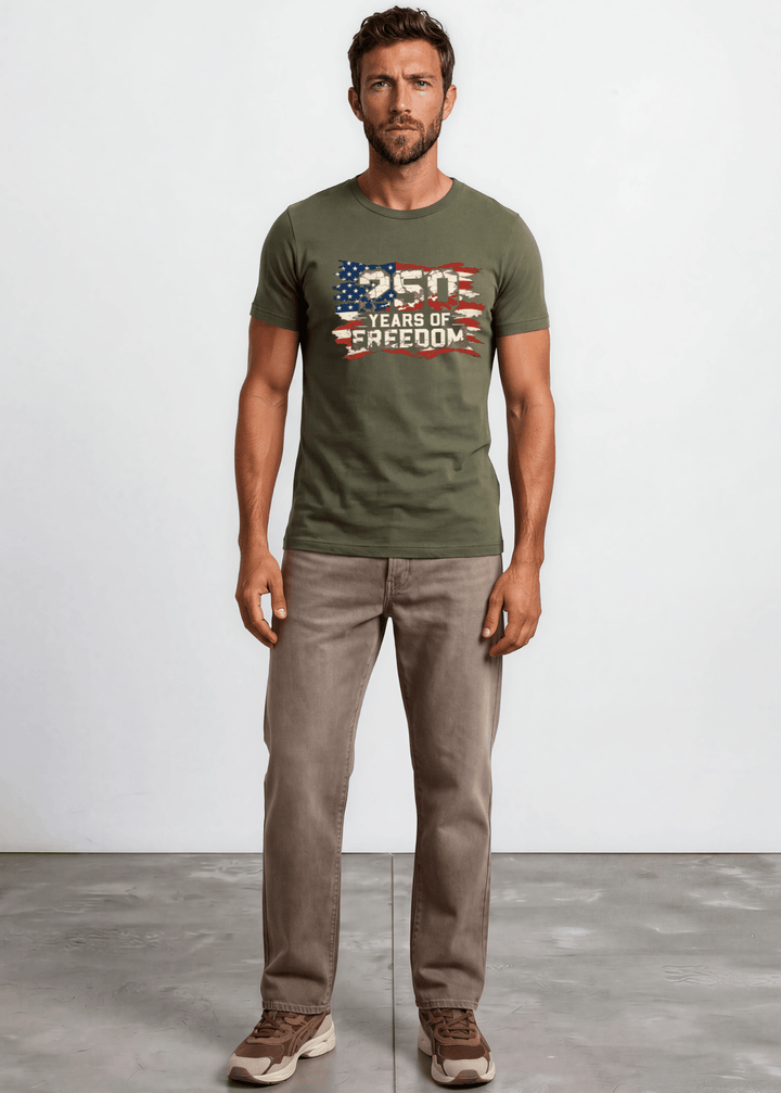 250 Years of Freedom Distressed Flag Tee — Made in USA. Bold cracked flag graphic on Army Green, soft 100% cotton, relaxed fit. Perfect for 4th of July. Sizes S-2XL.