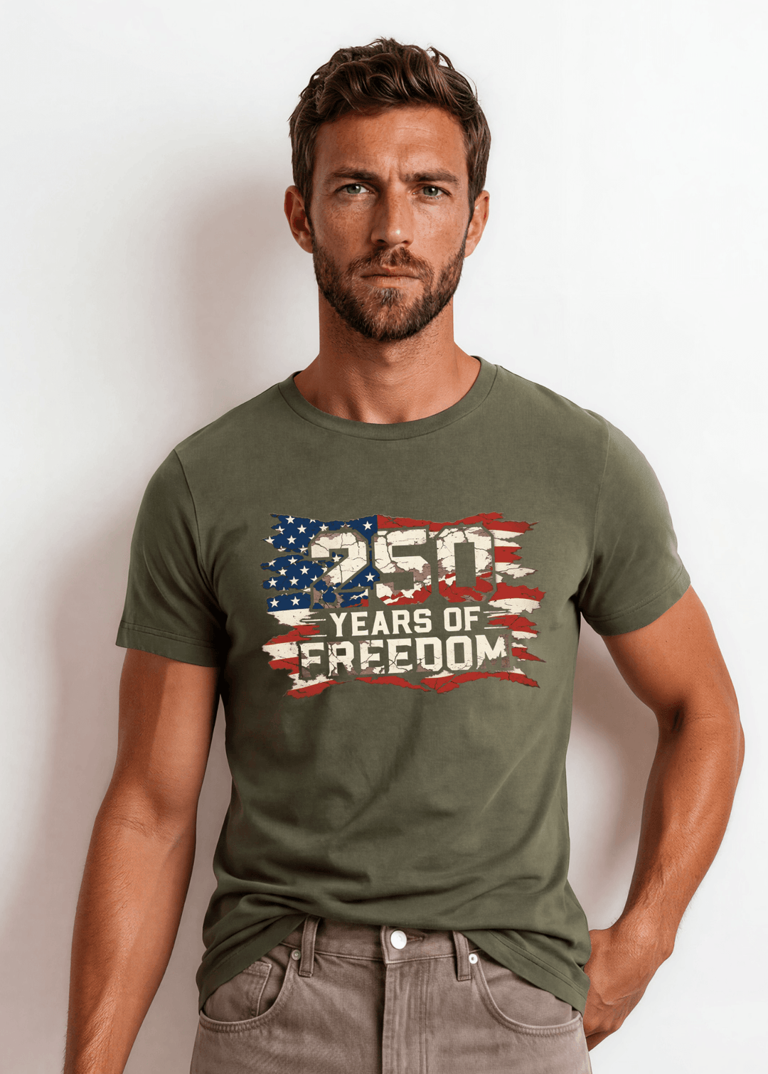 250 Years of Freedom Distressed Flag Tee — Made in USA. Bold cracked flag graphic on Army Green, soft 100% cotton, relaxed fit. Perfect for 4th of July. Sizes S-2XL.