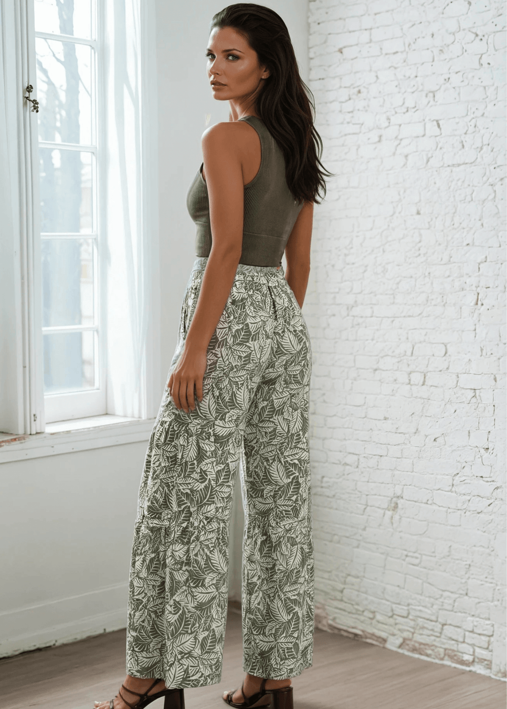 Elevate your casual wardrobe with these Made in USA Women's Soft Floral Pants, featuring a striking tiered leaf print in olive and off-white. Designed for all-day comfort, they boast a super soft ribbed fabric that's lightweight and breathable. 