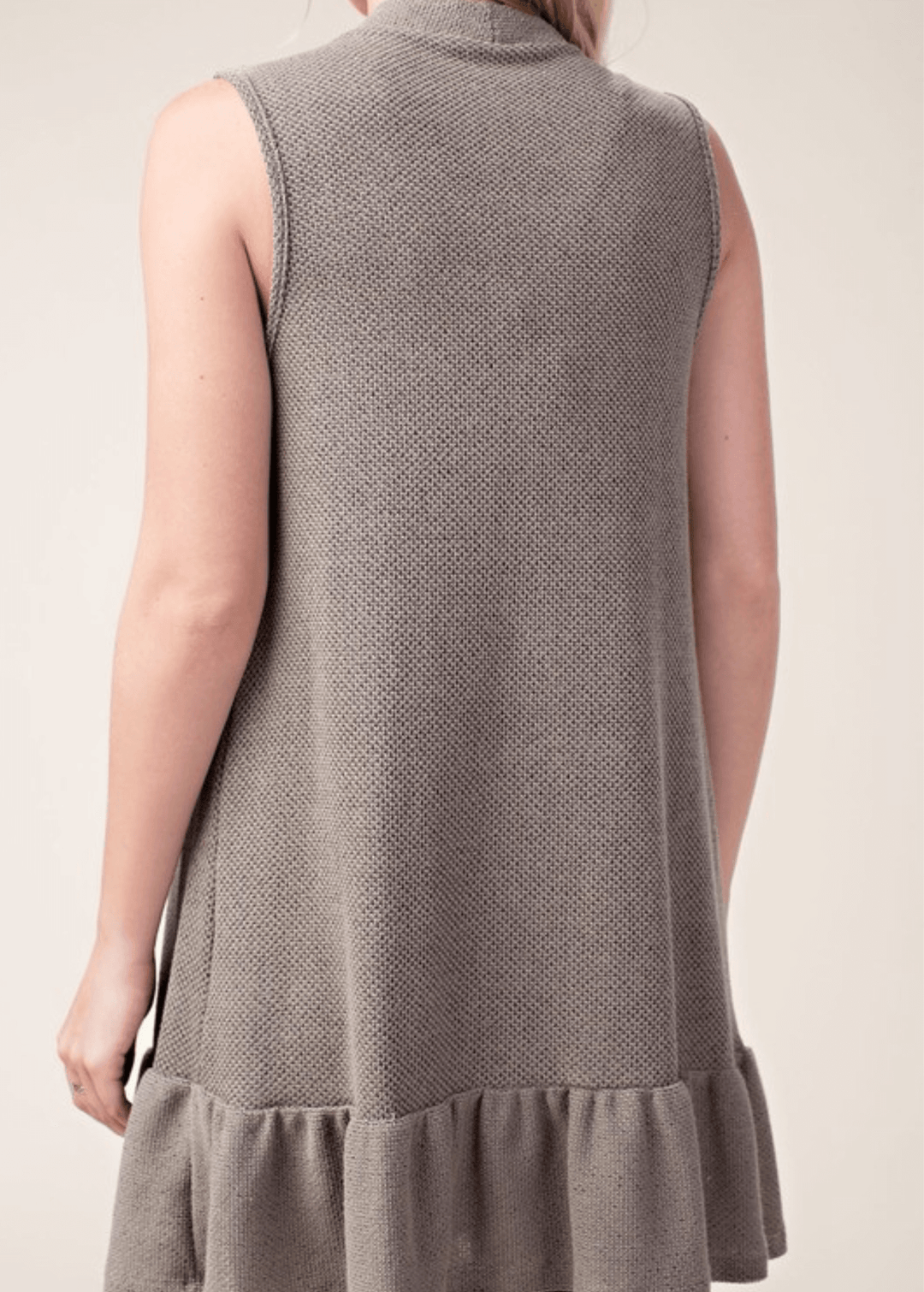 The Monica Open Front Ruffled Knit Accent Vest is your go-to layering piece for effortless style. This sleeveless cardigan vest features a charming flounce ruffle hem that adds movement and dimension to any outfit. 