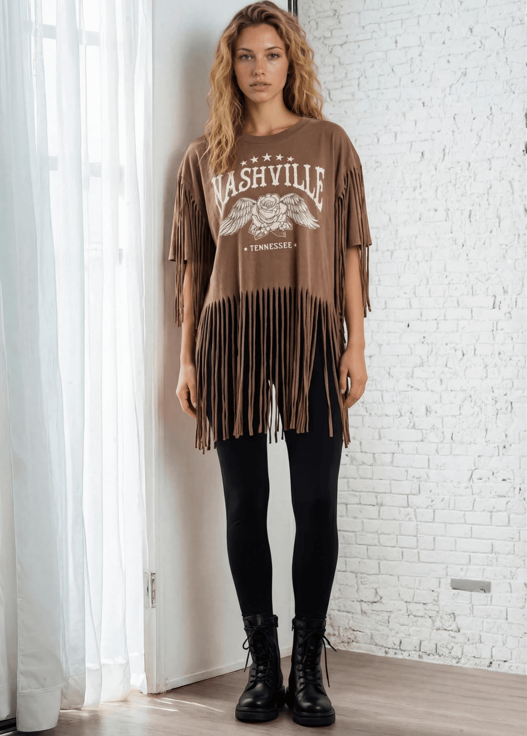 The Farrah Fringe Nashville Top brings effortless style to your everyday wardrobe. Featuring playful fringe detailing and a relaxed silhouette, this versatile piece pairs beautifully with jeans, leggings, or your favorite bottoms. The soft cotton-blend fabric with a touch of spandex offers comfort and gentle stretch, while the round neckline and short sleeves keep things casual and chic. Perfect for layering or wearing solo, this made-in-USA top is a wardrobe essential that works from season to season. 