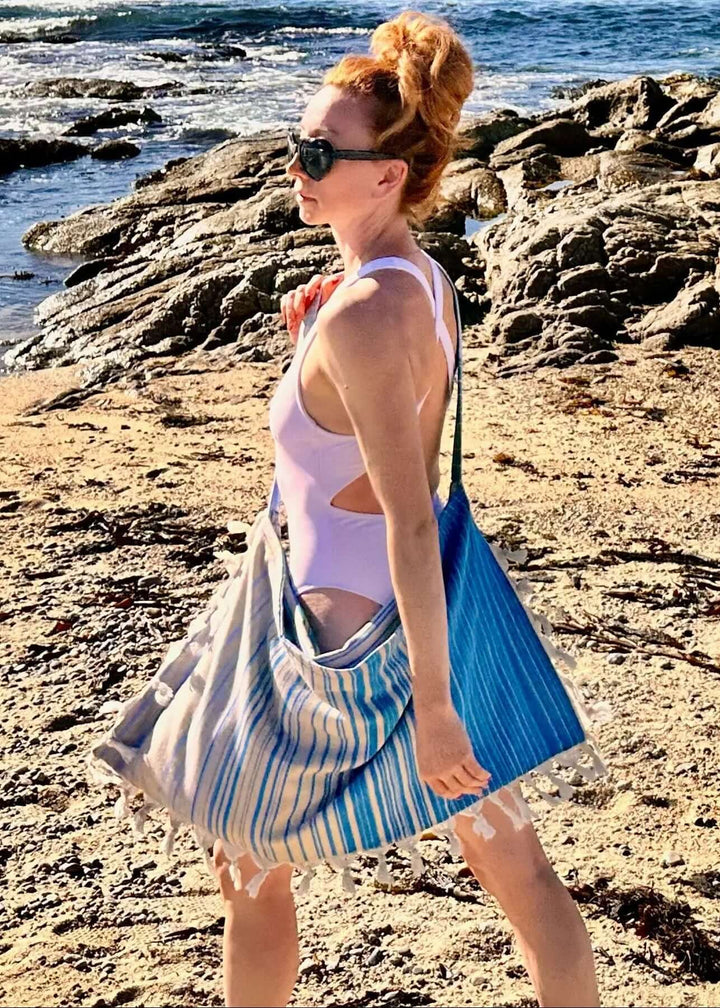 Shop the Beachables Striped 3-in-1 Turkish Cotton Beach Bag – converts from bag to towel to chair cover. Sand-resistant, quick-dry, machine washable. Made in USA.