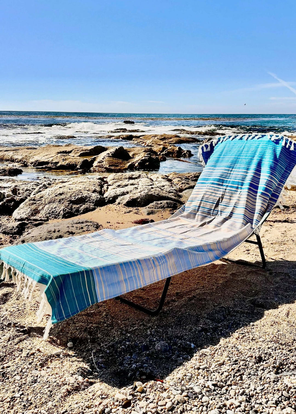 Shop the Beachables Striped 3-in-1 Turkish Cotton Beach Bag – converts from bag to towel to chair cover. Sand-resistant, quick-dry, machine washable. Made in USA.