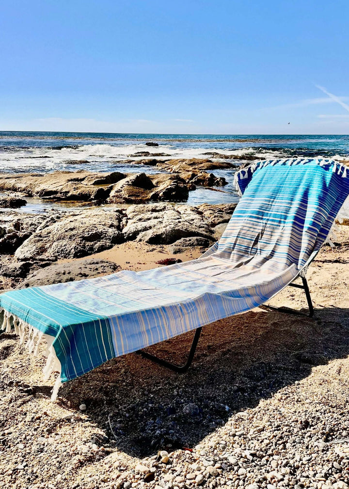 Shop the Beachables Striped 3-in-1 Turkish Cotton Beach Bag – converts from bag to towel to chair cover. Sand-resistant, quick-dry, machine washable. Made in USA.