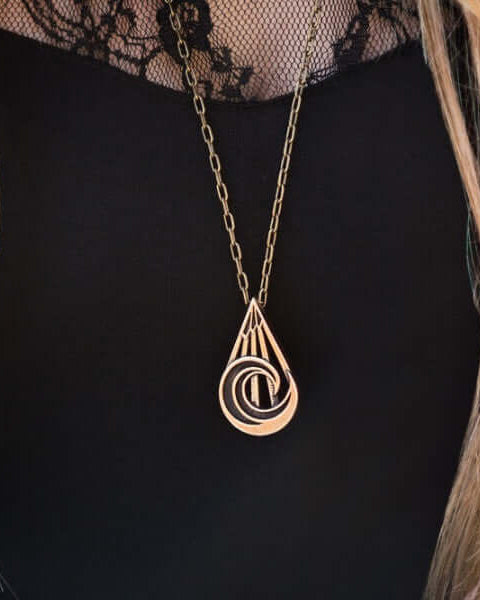 Handcrafted solid bronze mountain wave necklace on an 18 or 24 inch antique bronze chain. Made in USA with a lifetime warranty.