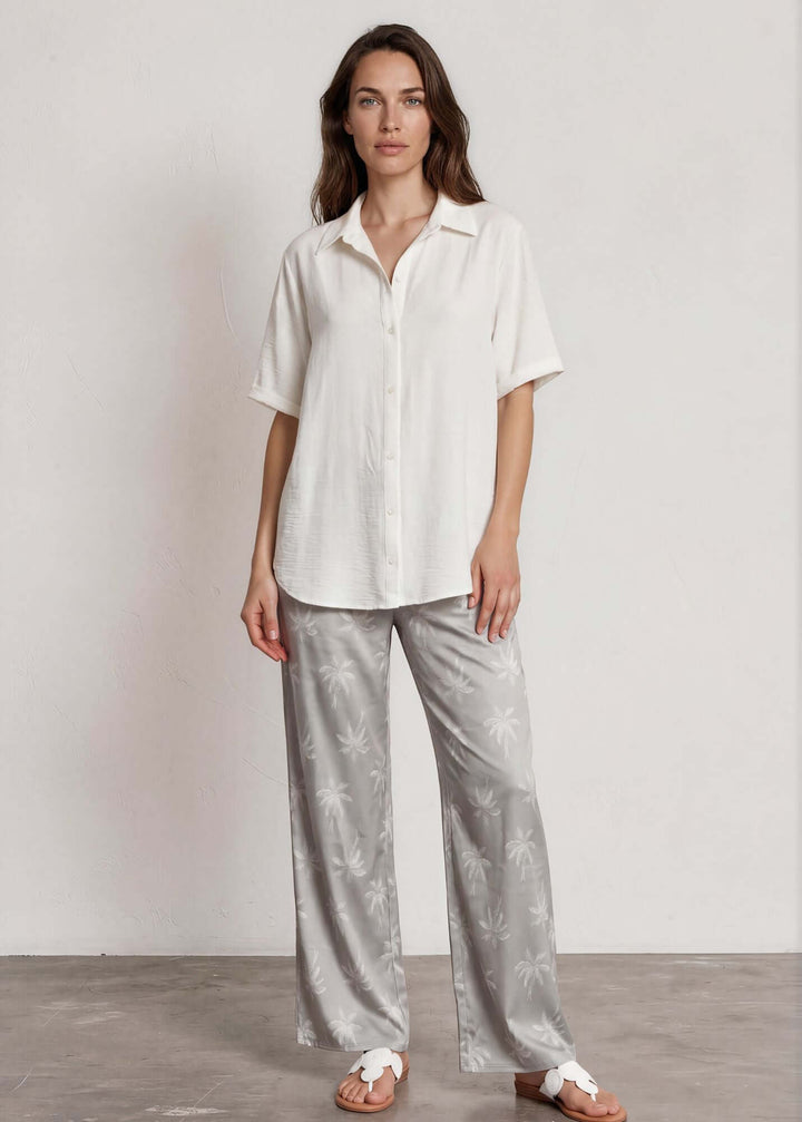  Presley Palm Tree Wide Leg Pants — a relaxed wide-leg style with a tonal palm print, elastic waist &amp; drawstring. Made in USA. Perfect for resort &amp; vacation.