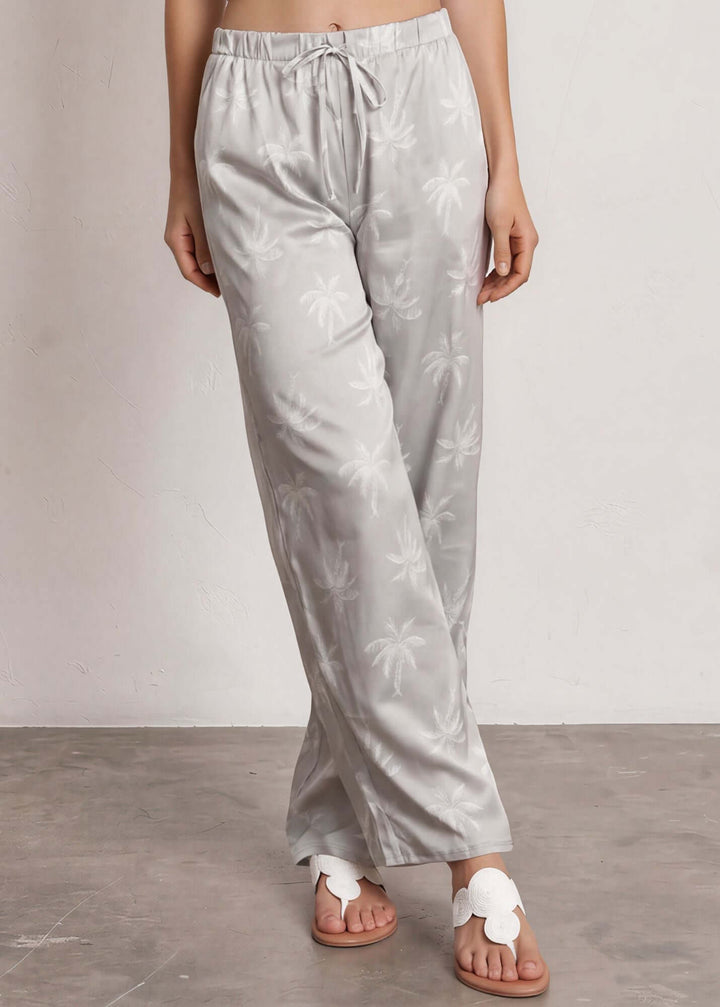  Presley Palm Tree Wide Leg Pants — a relaxed wide-leg style with a tonal palm print, elastic waist &amp; drawstring. Made in USA. Perfect for resort &amp; vacation.
