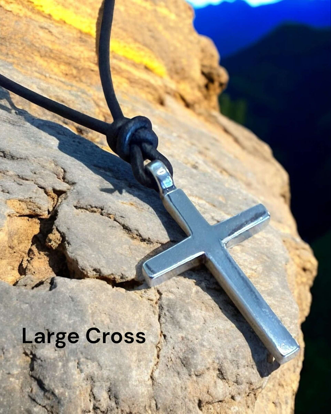 Handcrafted solid sterling silver cross on an adjustable leather cord. Unisex. Available in black, dark brown, or red brown. Made in USA