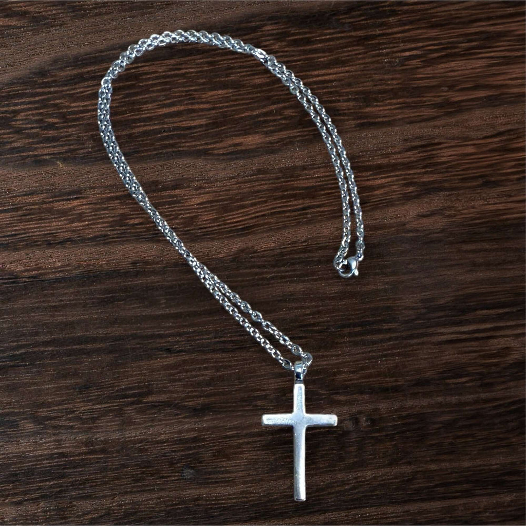 Handcrafted solid sterling silver cross necklace on a stainless steel chain. Custom lengths available. Made in USA with a lifetime warranty. 