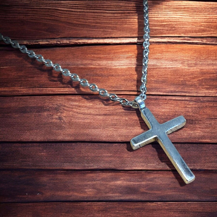 Handcrafted solid sterling silver cross necklace on a stainless steel chain. Custom lengths available. Made in USA with a lifetime warranty. 