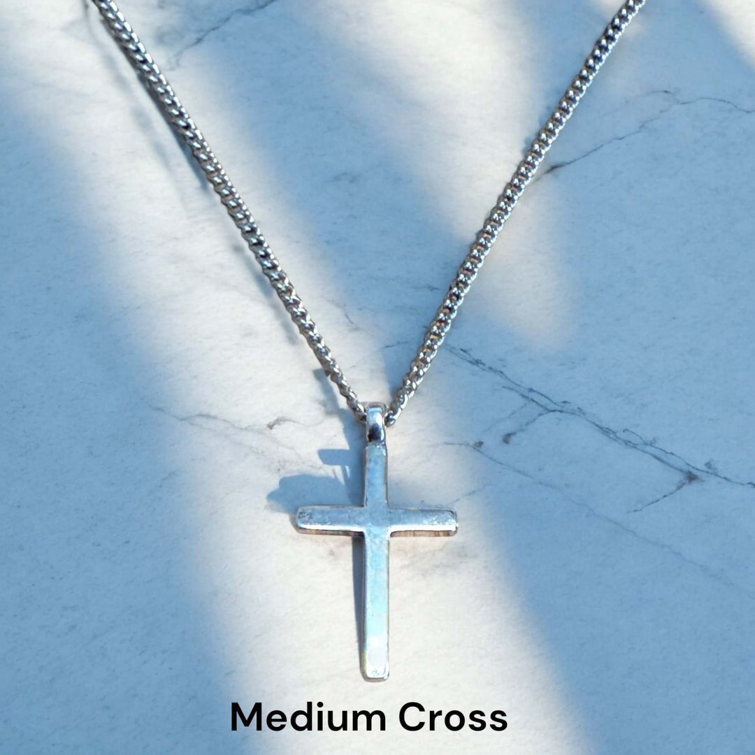 Handcrafted solid sterling silver cross necklace on a stainless steel chain. Custom lengths available. Made in USA with a lifetime warranty. 