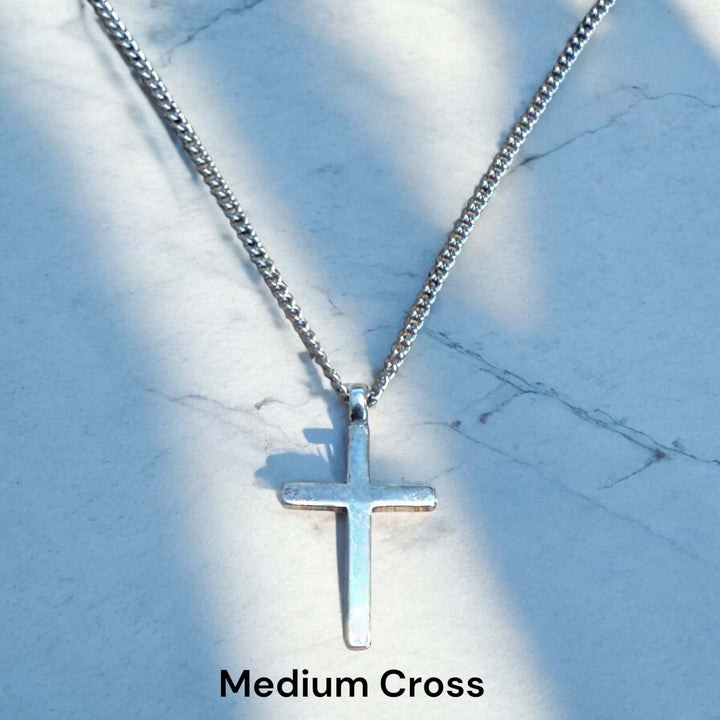 Handcrafted solid sterling silver cross necklace on a stainless steel chain. Custom lengths available. Made in USA with a lifetime warranty. 