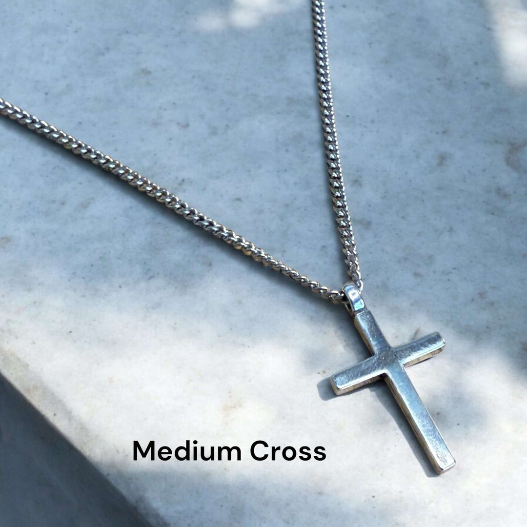 Handcrafted solid sterling silver cross necklace on a stainless steel chain. Custom lengths available. Made in USA with a lifetime warranty. 