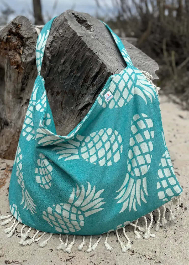 Shop the Beachables Pattern 3-in-1 Turkish Cotton Beach Bag – converts from bag to towel to chair cover. Sand-resistant, quick-dry, machine washable. Made in USA.