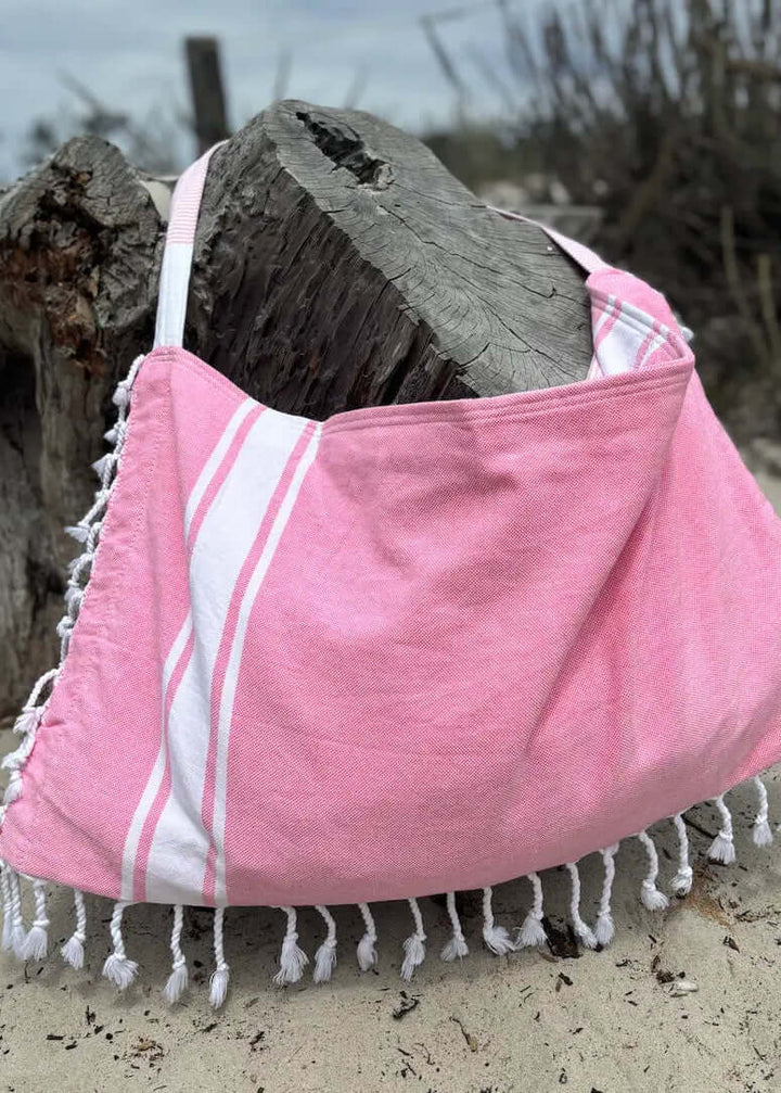 Shop the Beachables Solid 3-in-1 Turkish Cotton Beach Bag – converts from bag to towel to chair cover. Sand-resistant, quick-dry, machine washable. Made in USA.