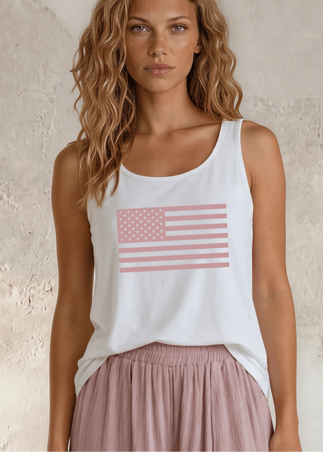 Say it in something made here! USA-made Patriotic Pink USA Flag Graphic tank in white garment wash. Soft 95% cotton, relaxed fit, grown & sewn in America.