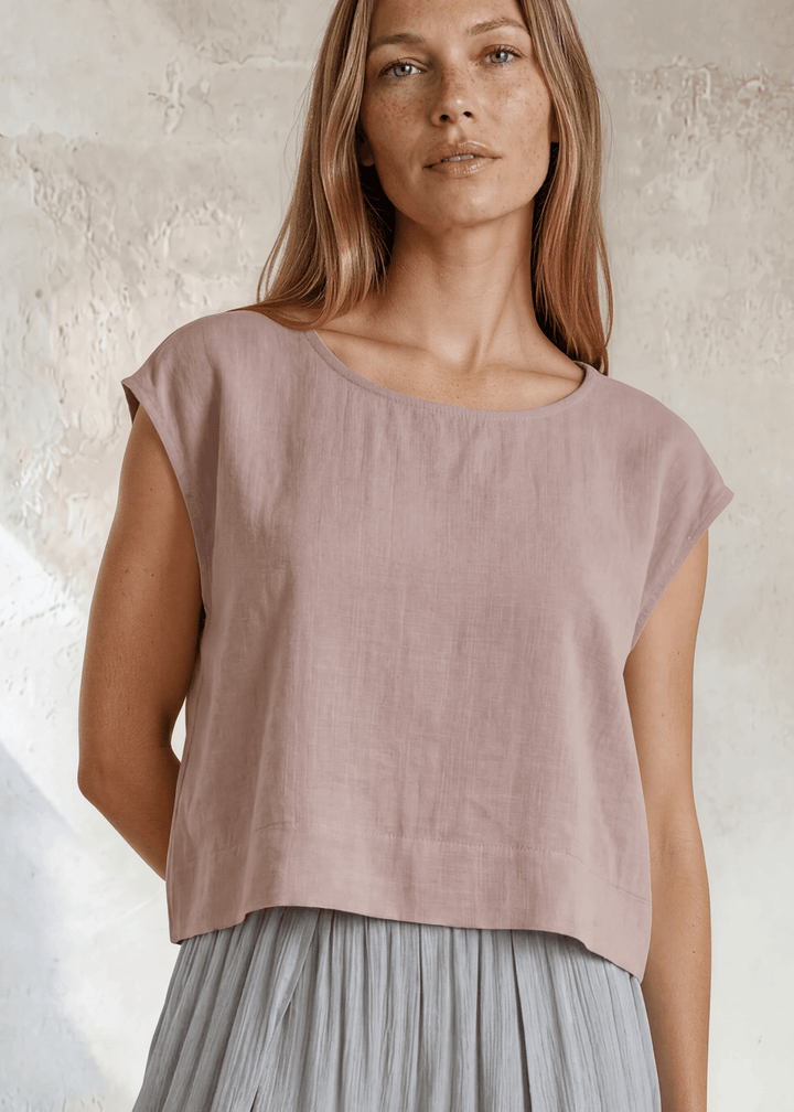 Shop the Bella Boxy Top in Rose Quartz — a lightweight 100% rayon crosshatch woven top with a relaxed fit and cap sleeves. Made in USA. True to size.