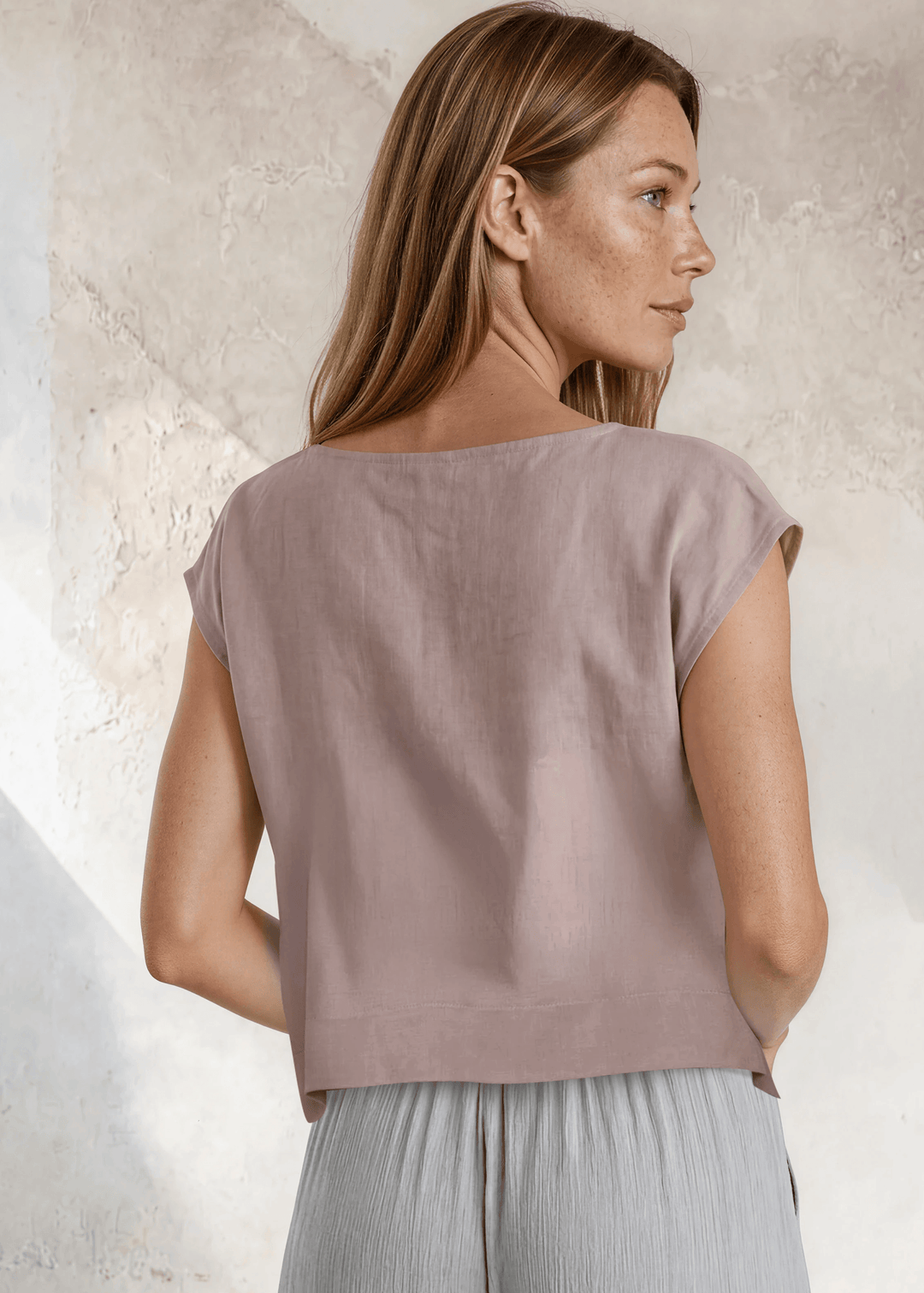 Shop the Bella Boxy Top in Rose Quartz — a lightweight 100% rayon crosshatch woven top with a relaxed fit and cap sleeves. Made in USA. True to size.