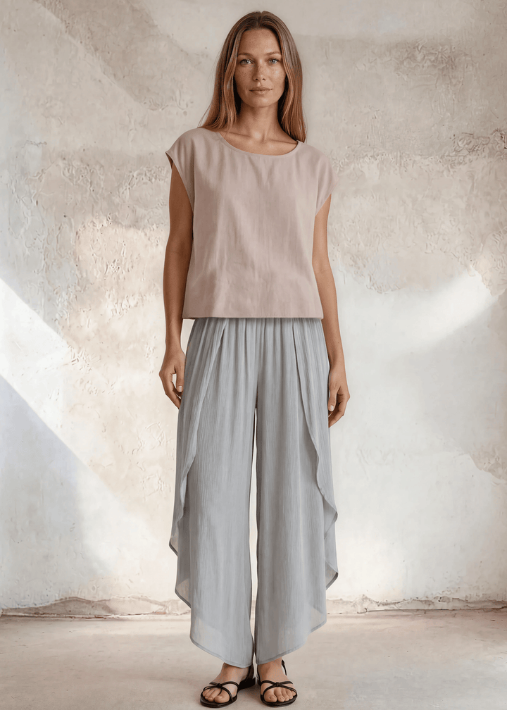 Shop the Bella Boxy Top in Rose Quartz — a lightweight 100% rayon crosshatch woven top with a relaxed fit and cap sleeves. Made in USA. True to size.