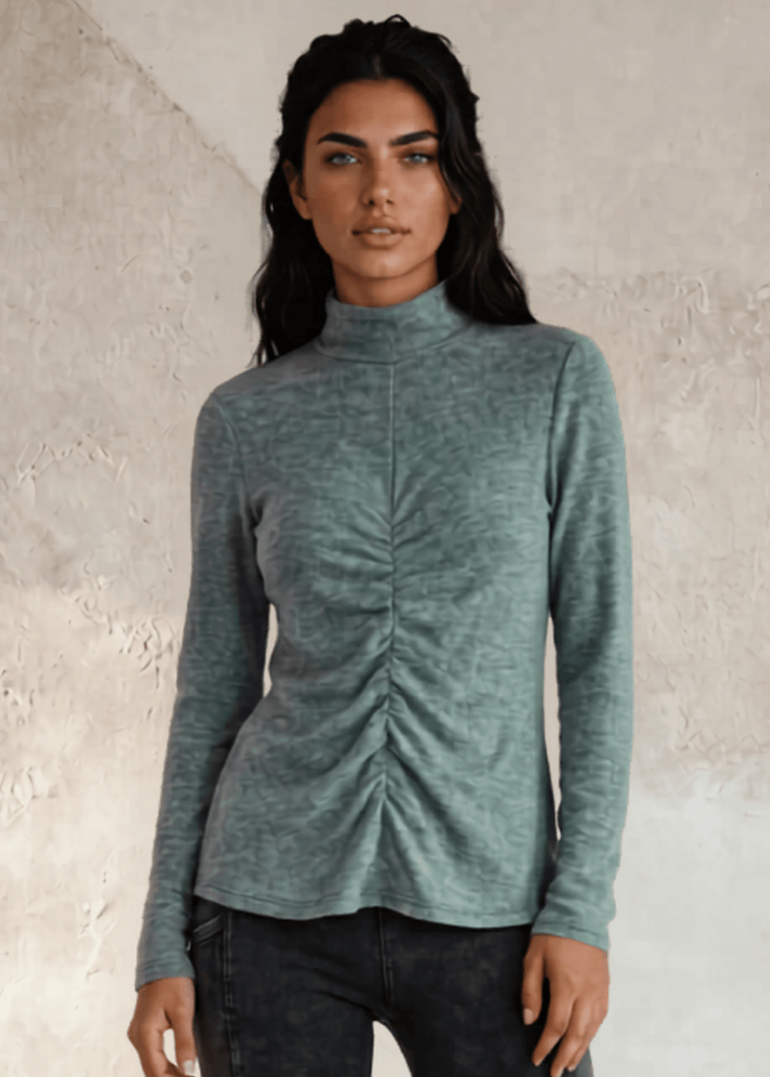 This Long Sleeve Mock Neck Top is a must-have for any wardrobe. It's perfect to wear under Jackets for a touch of uniqueness. Made in the USA with soft and stretchy ribbed knit fabric.