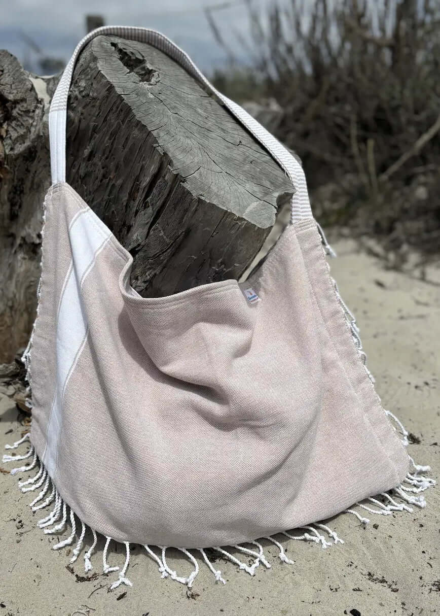 Shop the Beachables Solid 3-in-1 Turkish Cotton Beach Bag – converts from bag to towel to chair cover. Sand-resistant, quick-dry, machine washable. Made in USA.