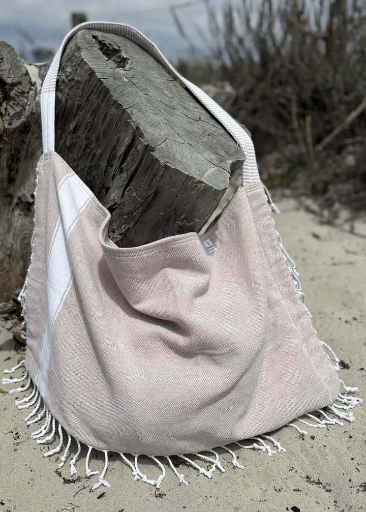 Shop the Beachables Solid 3-in-1 Turkish Cotton Beach Bag – converts from bag to towel to chair cover. Sand-resistant, quick-dry, machine washable. Made in USA.