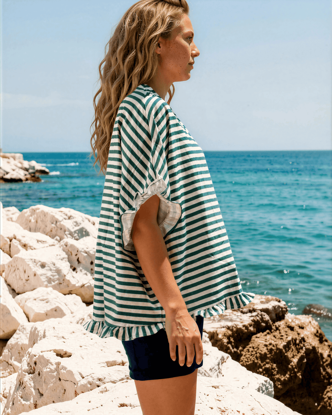 Effortlessly chic green &amp; white striped oversized top with ruffle cuffs &amp; button-up front. Lightweight, flowy fit perfect for spring &amp; summer. Made in USA.