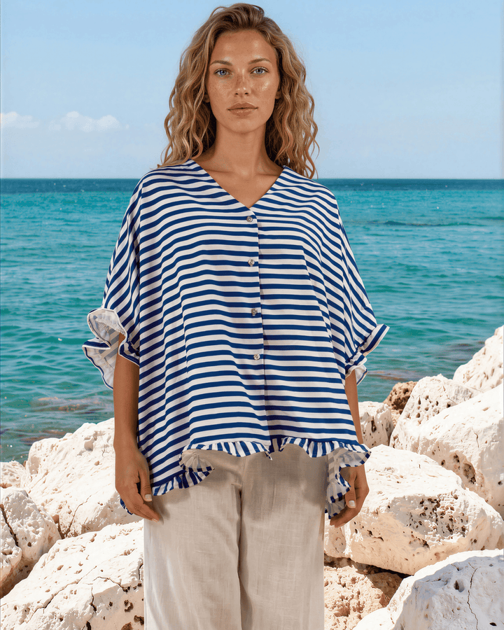 Effortlessly chic blue &amp; white striped oversized top with ruffle cuffs &amp; button-up front. Lightweight, flowy fit perfect for spring &amp; summer. Made in USA.