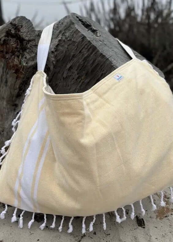 Shop the Beachables Solid 3-in-1 Turkish Cotton Beach Bag – converts from bag to towel to chair cover. Sand-resistant, quick-dry, machine washable. Made in USA.