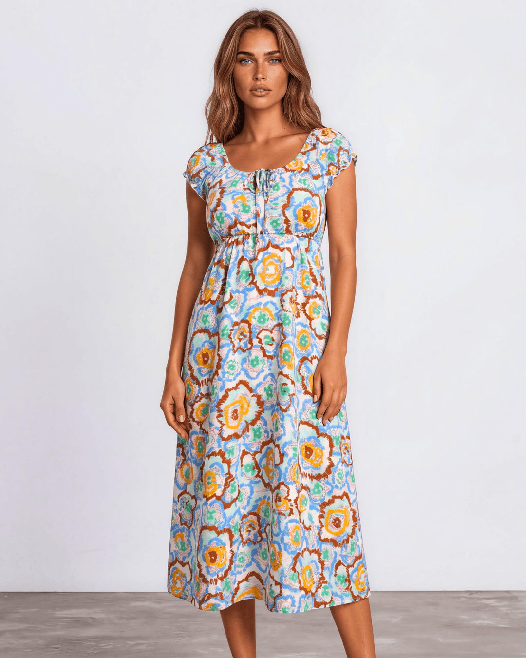 Our Sydney Sumer Vacation Sundress in Breezy rayon-linen blend, smocked waist & bold colorful abstract floral print — your new vacation dress. Made in USA
