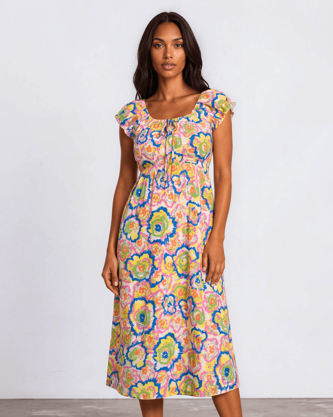 Our Sydney Sumer Vacation Sundress in Breezy rayon-linen blend, smocked waist & bold pink abstract floral print — your new vacation dress. Made in USA