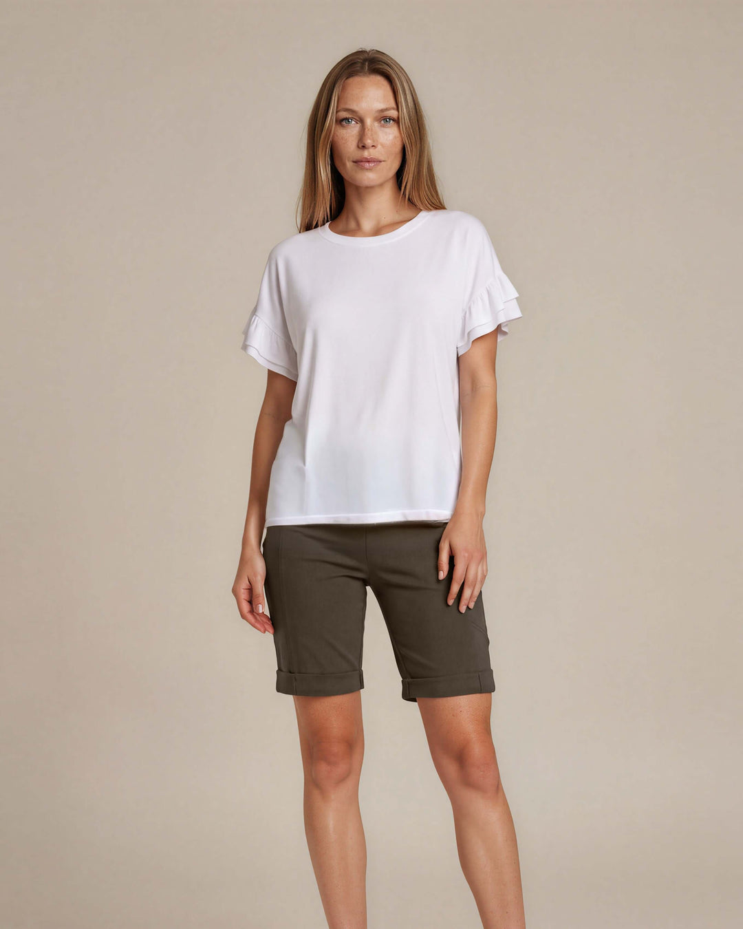 Shop the Ruffle Sleeve T-Shirt in white. Oversized fit, double flutter sleeves, crew neck. 95% Cotton, 5% Spandex. S–L. Made in USA. Free shipping may apply.