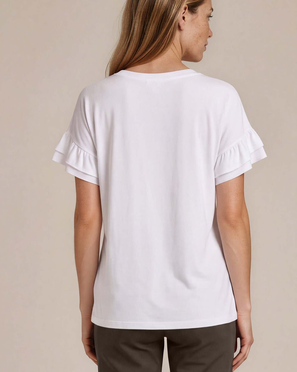 Shop the Ruffle Sleeve T-Shirt in white. Oversized fit, double flutter sleeves, crew neck. 95% Cotton, 5% Spandex. S–L. Made in USA. Free shipping may apply.